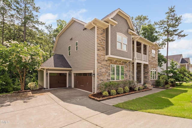 728 Peninsula Forest Pl, Cary, NC 27519 - view of home's exterior with a garage, stone siding, driveway, and a yard