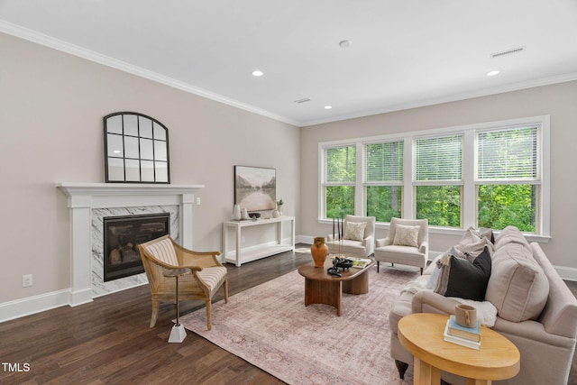 728 Peninsula Forest Pl, Cary, NC 27519 - living room featuring wood finished floors, recessed lighting, a high end fireplace, and ornamental molding