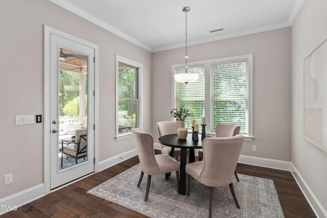 728 Peninsula Forest Pl, Cary, NC 27519 - dining area featuring dark wood-style flooring, plenty of natural light, and ornamental molding
