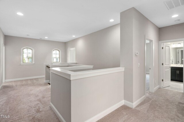 728 Peninsula Forest Pl, Cary, NC 27519 - hallway featuring light carpet, an upstairs landing, and recessed lighting