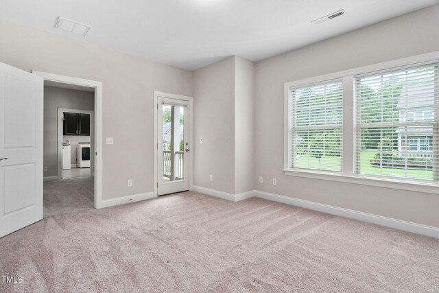 728 Peninsula Forest Pl, Cary, NC 27519 - carpeted spare room featuring washer / dryer