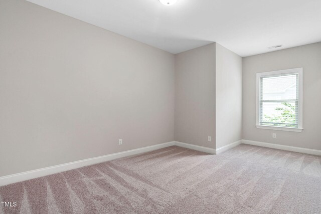 728 Peninsula Forest Pl, Cary, NC 27519 - spare room with light carpet and baseboards