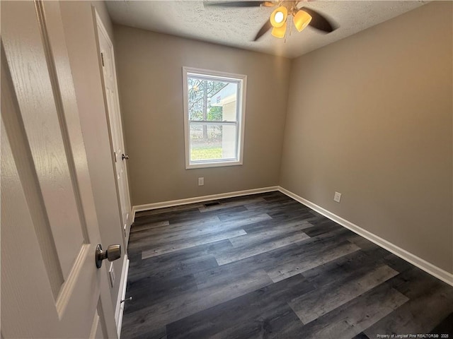 2903 Peacock St, Hope Mills, NC 28348 - unfurnished room featuring ceiling fan, baseboards, dark wood finished floors, and a textured ceiling