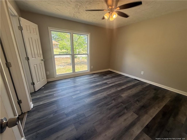 2903 Peacock St, Hope Mills, NC 28348 - spare room with a textured ceiling, ceiling fan, baseboards, and dark wood-style flooring