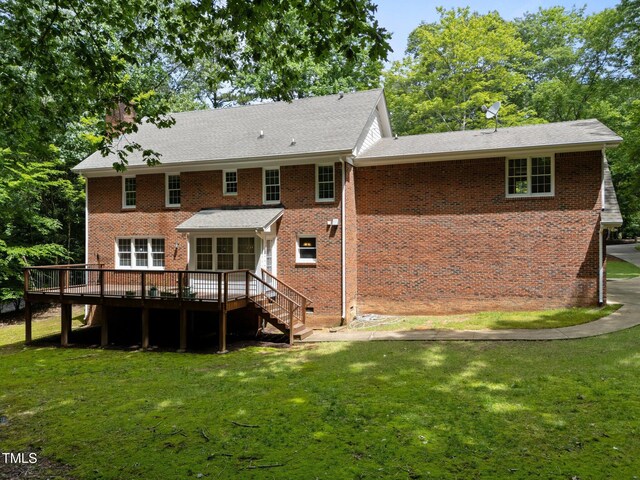 221 Jansmith Ln, Raleigh, NC 27615 - rear view of property with a deck, brick siding, a yard, and stairway