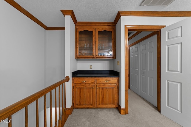 221 Jansmith Ln, Raleigh, NC 27615 - hallway with light carpet, crown molding, and a textured ceiling