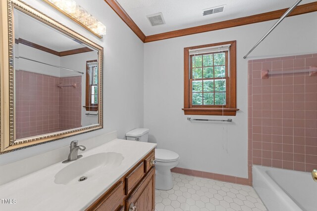221 Jansmith Ln, Raleigh, NC 27615 - full bath with vanity, toilet, crown molding, tile patterned floors, and shower / washtub combination