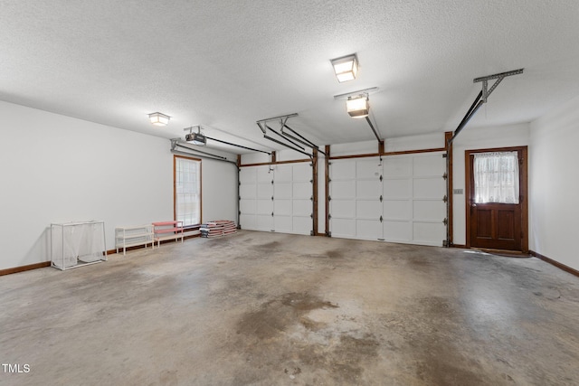 221 Jansmith Ln, Raleigh, NC 27615 - garage with a garage door opener and baseboards