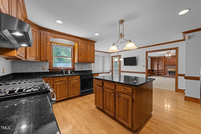 221 Jansmith Ln, Raleigh, NC 27615 - kitchen featuring black dishwasher, extractor fan, a sink, gas range, and light wood finished floors