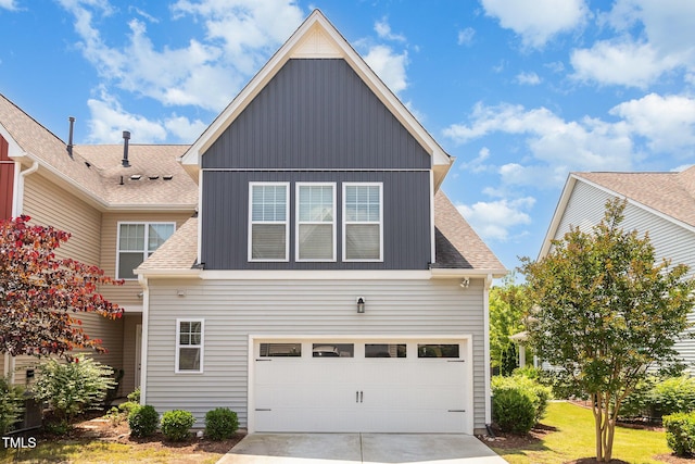 921 Rosepine Dr, Cary, NC 27519 - view of front facade with roof with shingles, board and batten siding, concrete driveway, and an attached garage
