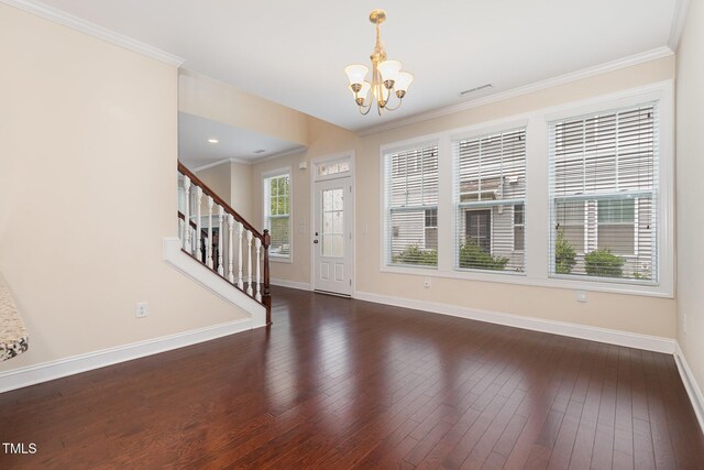 921 Rosepine Dr, Cary, NC 27519 - entryway with a chandelier, dark wood-type flooring, stairway, and ornamental molding