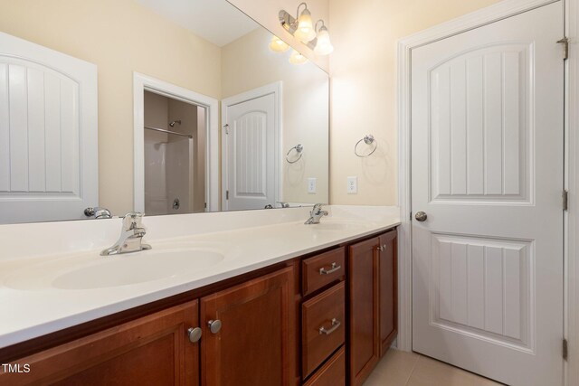 921 Rosepine Dr, Cary, NC 27519 - full bath featuring double vanity, a shower, and tile patterned flooring
