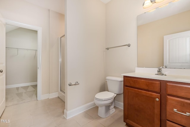 921 Rosepine Dr, Cary, NC 27519 - bathroom featuring vanity, a shower stall, a spacious closet, and tile patterned flooring
