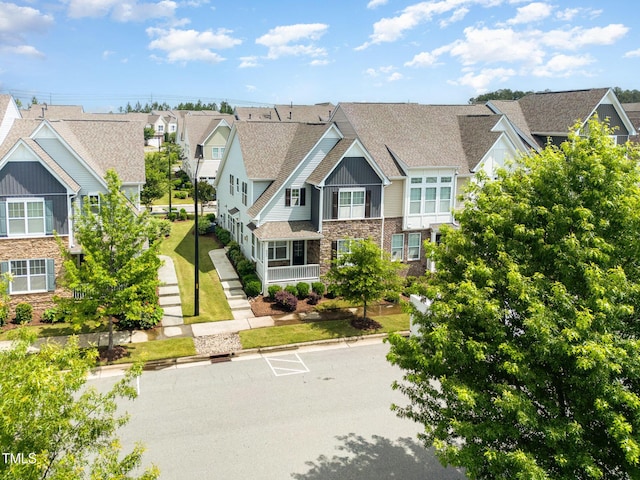 921 Rosepine Dr, Cary, NC 27519 - view of front of property featuring stone siding, a residential view, and board and batten siding