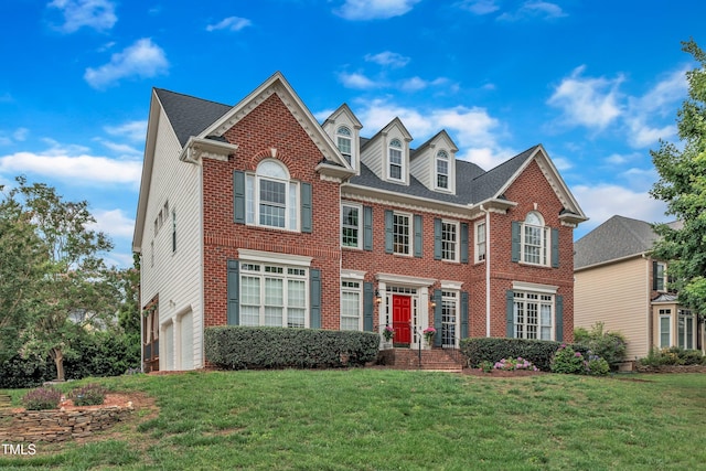 2224 Narrawood St, Raleigh, NC 27614 - colonial house featuring brick siding, a garage, and a front yard