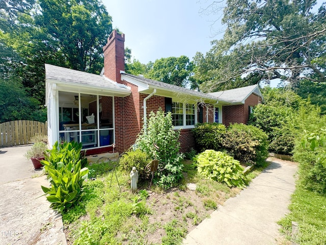 518 Heater Dr, Cary, NC 27511 - view of front of property with brick siding and a chimney