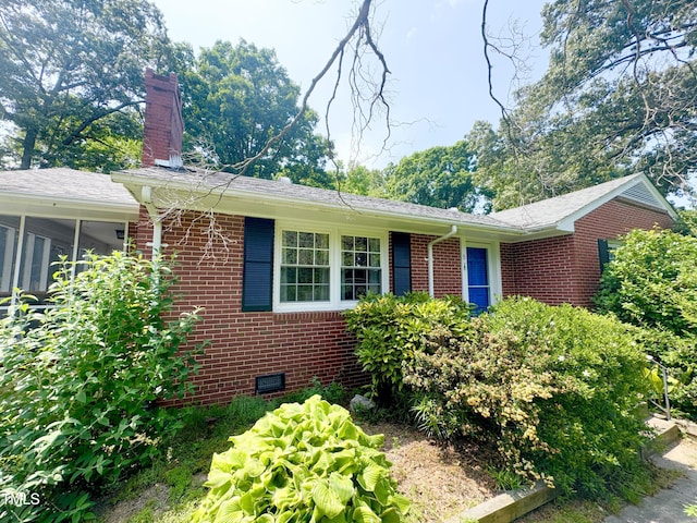518 Heater Dr, Cary, NC 27511 - view of front of property featuring brick siding, a chimney, crawl space, and roof with shingles