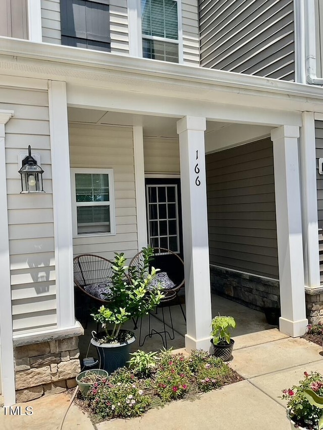 166 Gulley Glen Dr, Garner, NC 27529 - view of exterior entry with a porch