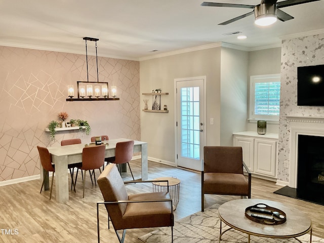 166 Gulley Glen Dr, Garner, NC 27529 - living area featuring ceiling fan, light wood-style flooring, ornamental molding, and a chandelier