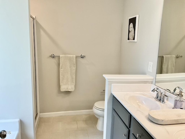 166 Gulley Glen Dr, Garner, NC 27529 - bathroom featuring toilet, vanity, tile patterned flooring, an enclosed shower, and baseboards