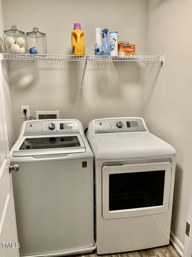 166 Gulley Glen Dr, Garner, NC 27529 - laundry room featuring independent washer and dryer and wood finished floors