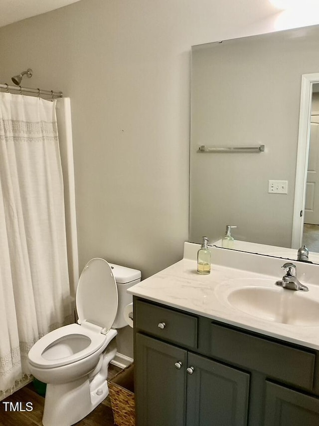 166 Gulley Glen Dr, Garner, NC 27529 - bathroom featuring toilet, vanity, wood finished floors, and curtained shower