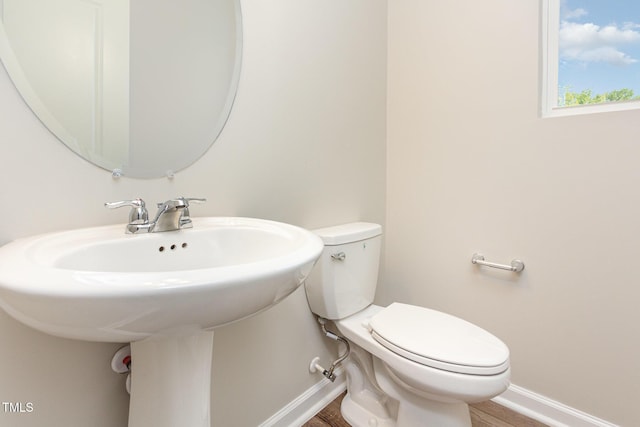 591 Traditions Grande Blvd, Wake Forest, NC 27587 - bathroom with baseboards, toilet, wood finished floors, and a sink