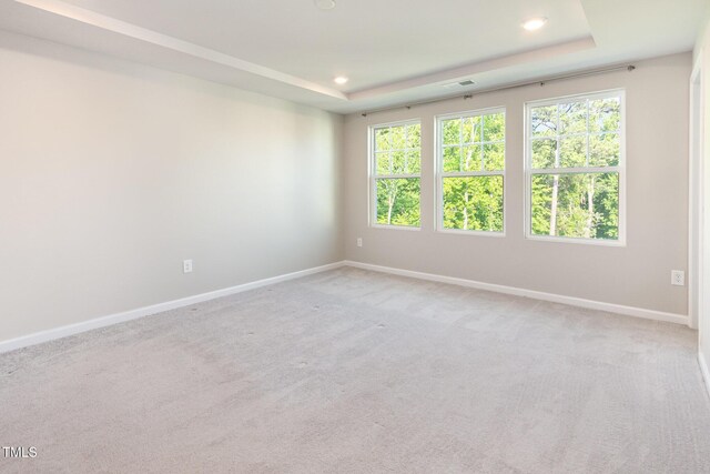 591 Traditions Grande Blvd, Wake Forest, NC 27587 - unfurnished room featuring recessed lighting, baseboards, a raised ceiling, and light colored carpet