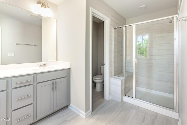 591 Traditions Grande Blvd, Wake Forest, NC 27587 - bathroom with vanity, toilet, and a stall shower