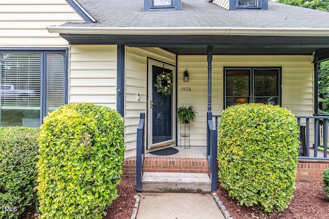 1426 Cedar Branch Ct, Wake Forest, NC 27587 - entrance to property featuring a porch and roof with shingles