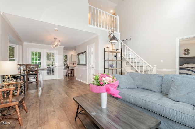 1426 Cedar Branch Ct, Wake Forest, NC 27587 - living room featuring ornamental molding, wood finished floors, a chandelier, stairs, and baseboards