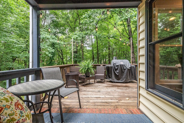 1426 Cedar Branch Ct, Wake Forest, NC 27587 - wooden terrace with area for grilling and view of scattered trees
