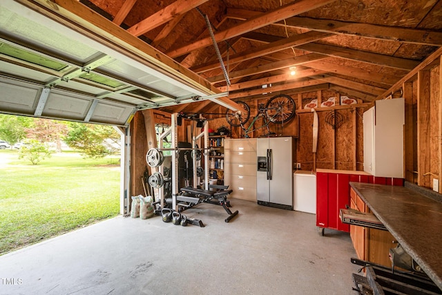 701 Creekside Dr, Clayton, NC 27520 - garage featuring fridge with ice dispenser
