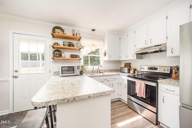 701 Creekside Dr, Clayton, NC 27520 - kitchen with stainless steel appliances, under cabinet range hood, a sink, light countertops, and crown molding