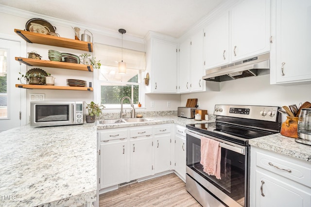701 Creekside Dr, Clayton, NC 27520 - kitchen featuring stainless steel appliances, under cabinet range hood, a sink, plenty of natural light, and crown molding