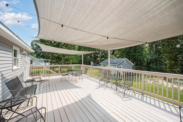 701 Creekside Dr, Clayton, NC 27520 - wooden deck with outdoor dining space, an outdoor structure, and a lawn