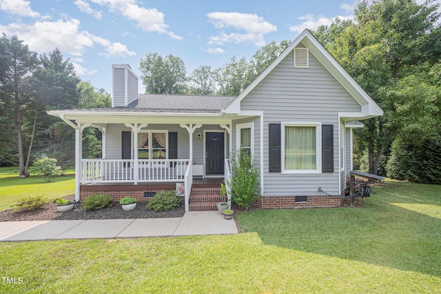 701 Creekside Dr, Clayton, NC 27520 - view of front of home featuring crawl space, covered porch, a chimney, a front yard, and a shingled roof