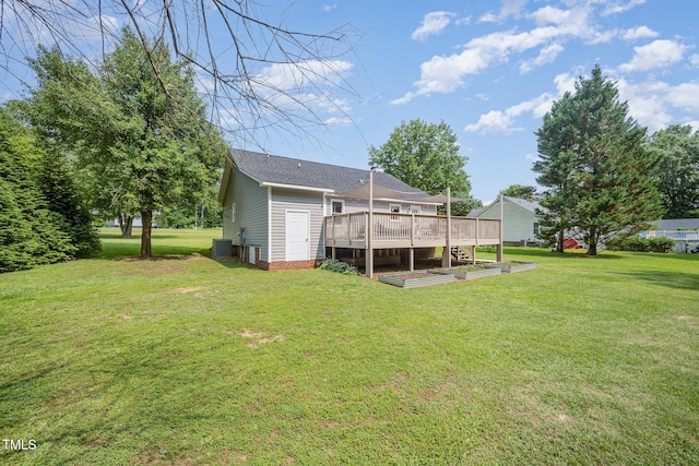 701 Creekside Dr, Clayton, NC 27520 - view of green lawn with a deck and central AC unit