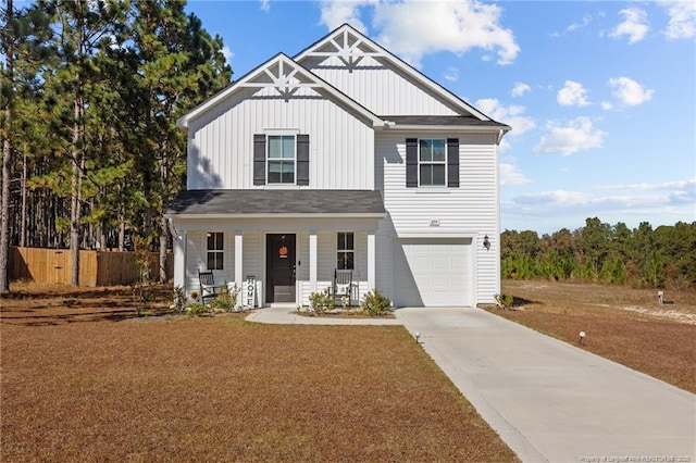 259 Desert Orchid Cir, Raeford, NC 28376 - view of front of home featuring board and batten siding, covered porch, concrete driveway, and a garage
