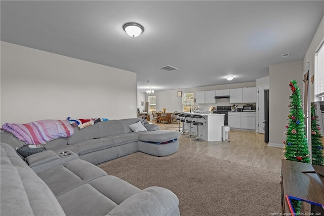 259 Desert Orchid Cir, Raeford, NC 28376 - living room featuring light wood-style flooring