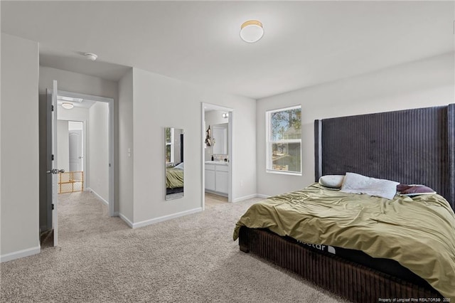 259 Desert Orchid Cir, Raeford, NC 28376 - bedroom featuring light colored carpet, baseboards, and ensuite bathroom