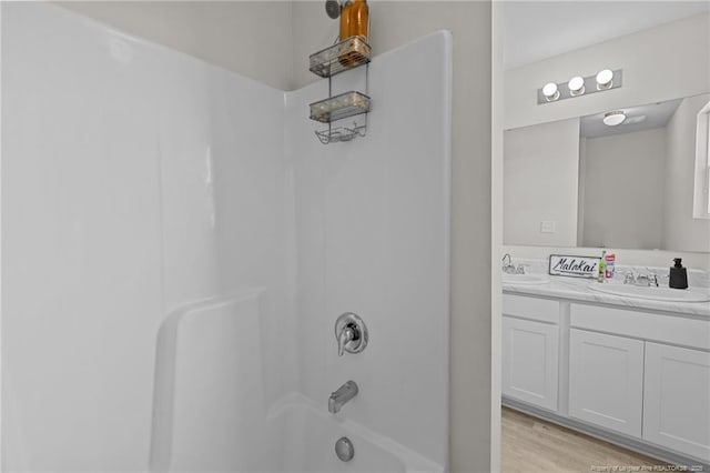 259 Desert Orchid Cir, Raeford, NC 28376 - full bathroom with tub / shower combination, double vanity, and wood finished floors