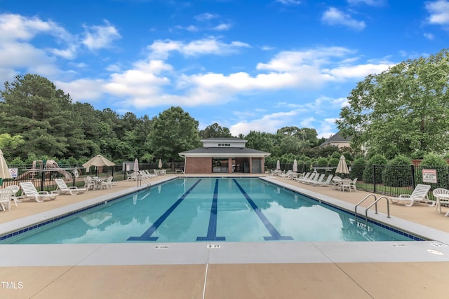 6509 Conaway Ct, Wake Forest, NC 27587 - community pool featuring a patio area and view of scattered trees