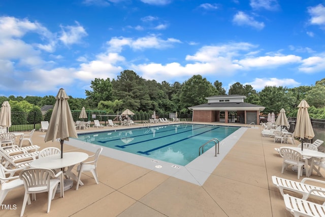 6509 Conaway Ct, Wake Forest, NC 27587 - community pool featuring a patio area and view of scattered trees
