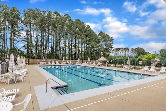 6509 Conaway Ct, Wake Forest, NC 27587 - community pool with a patio and view of wooded area