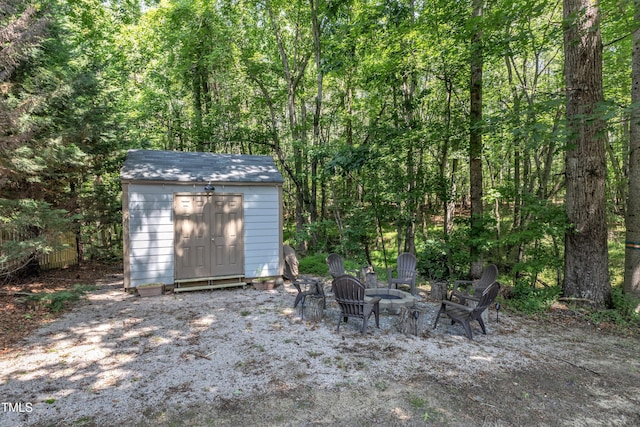 6509 Conaway Ct, Wake Forest, NC 27587 - view of patio with a fire pit and a forest view