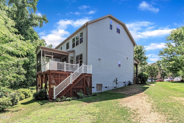 6509 Conaway Ct, Wake Forest, NC 27587 - back of property with a sunroom, stairway, a lawn, and a ceiling fan