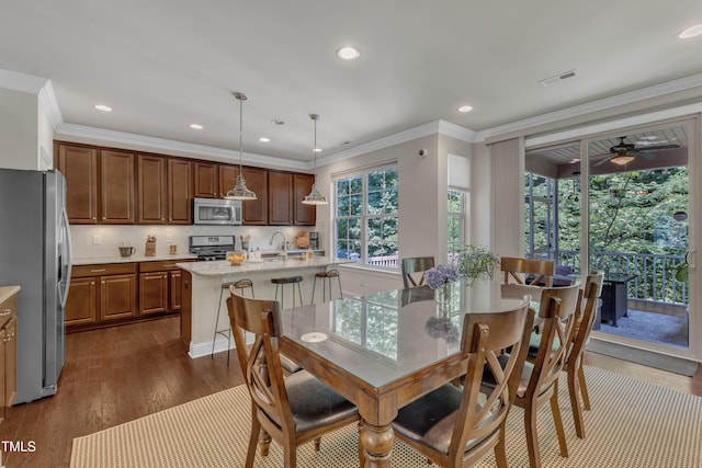 6509 Conaway Ct, Wake Forest, NC 27587 - dining room with dark wood-style flooring, recessed lighting, ornamental molding, and ceiling fan