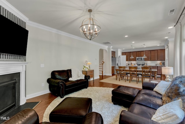 6509 Conaway Ct, Wake Forest, NC 27587 - living area featuring ornamental molding, baseboards, a chandelier, dark wood-style flooring, and recessed lighting