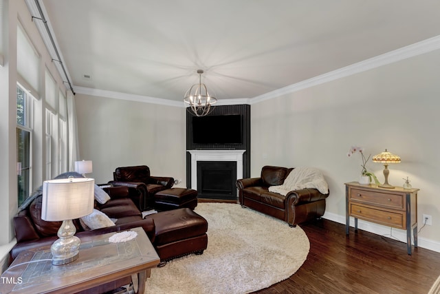 6509 Conaway Ct, Wake Forest, NC 27587 - living room featuring crown molding, a chandelier, dark wood-style floors, a fireplace with flush hearth, and baseboards